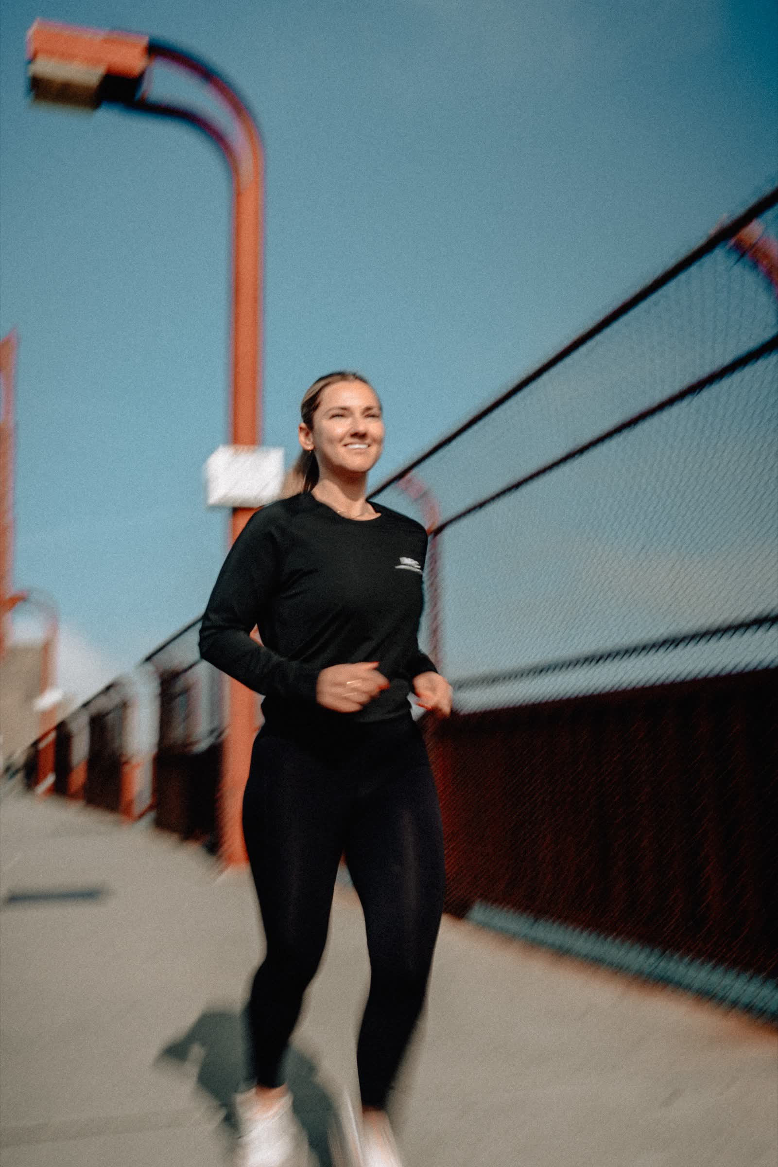 Marina Run Club member running by the Golden Gate Bridge
